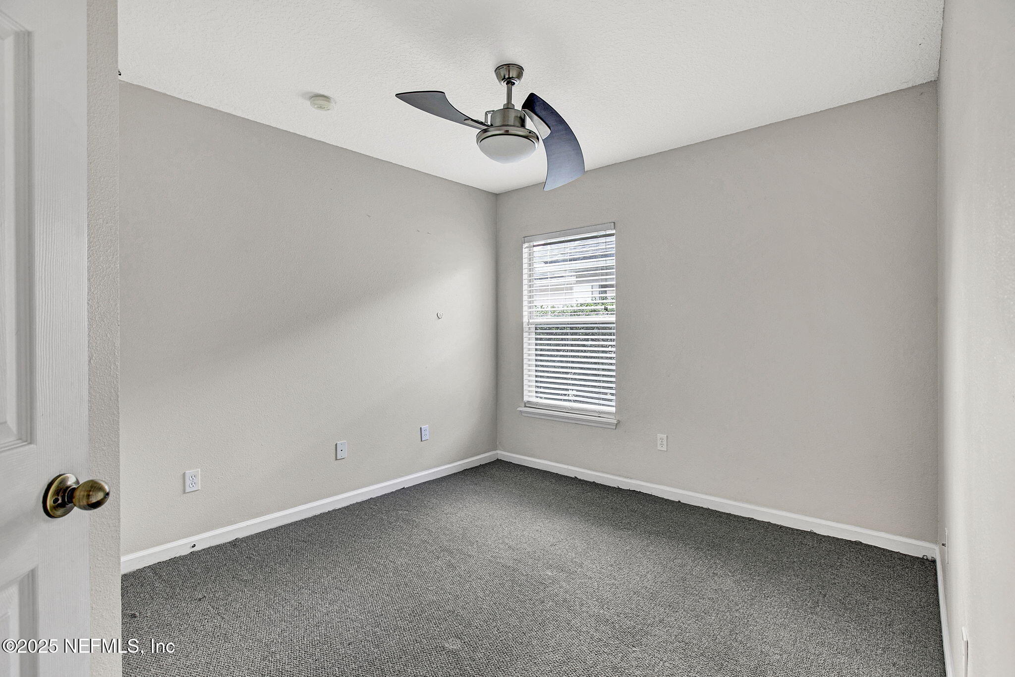 2105 South Cranbrook Avenue St. Augustine, FL 32092 - Photo 17 of 23 a view of a room with a window and a ceiling fan