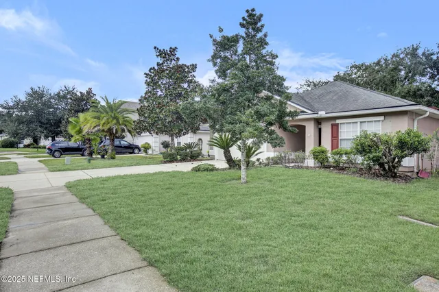a house view with a garden space