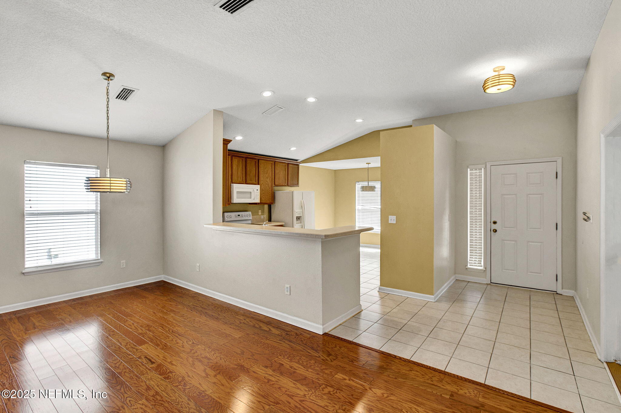 2105 South Cranbrook Avenue St. Augustine, FL 32092 - Photo 4 of 23 a view of an empty room with window and wooden floor