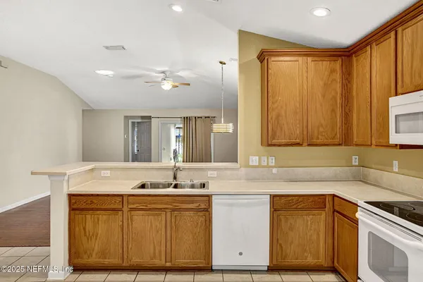 a bathroom with a sink vanity and mirror