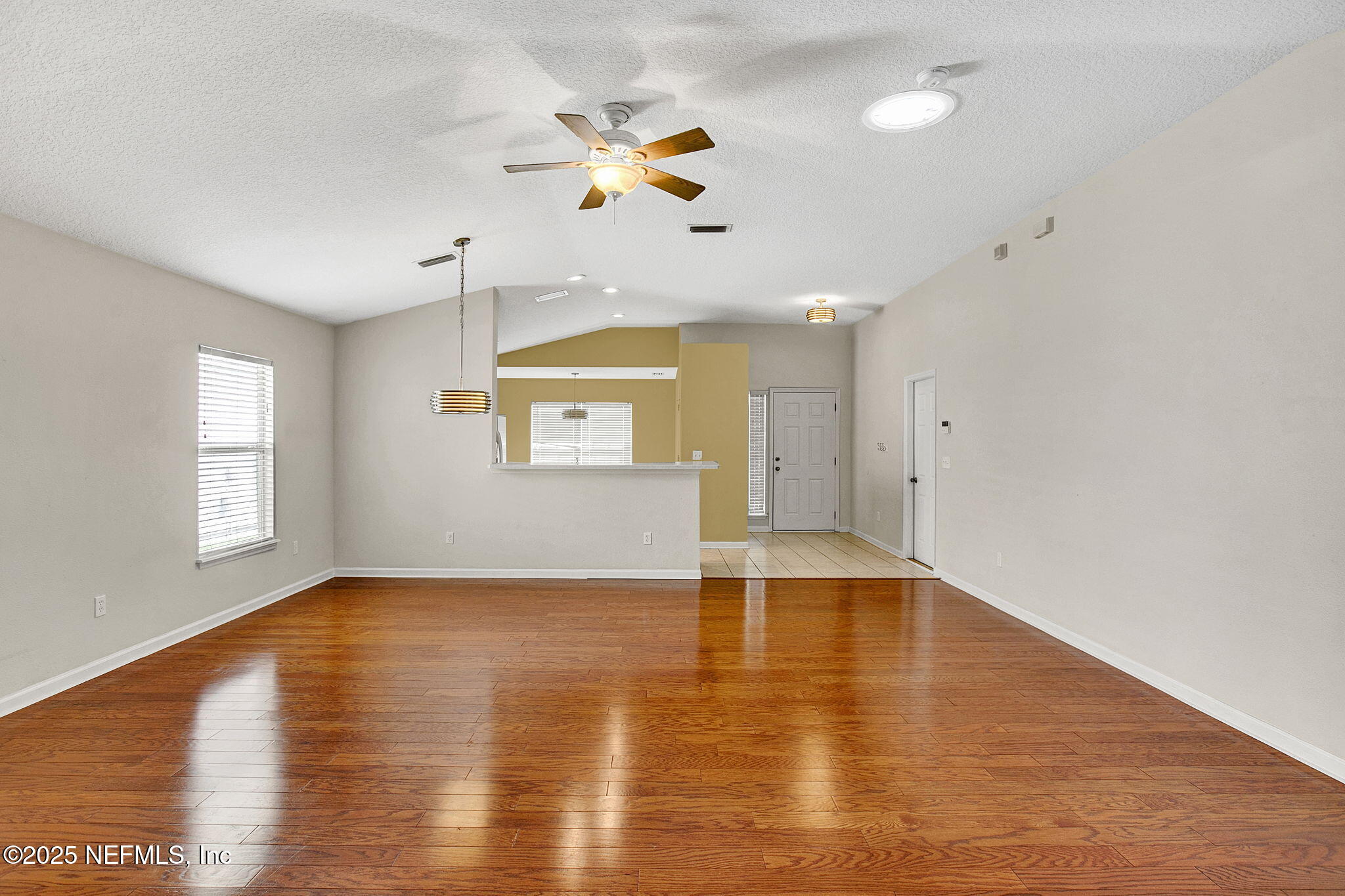 2105 South Cranbrook Avenue St. Augustine, FL 32092 - Photo 10 of 23 a view of an empty room with window and wooden floor