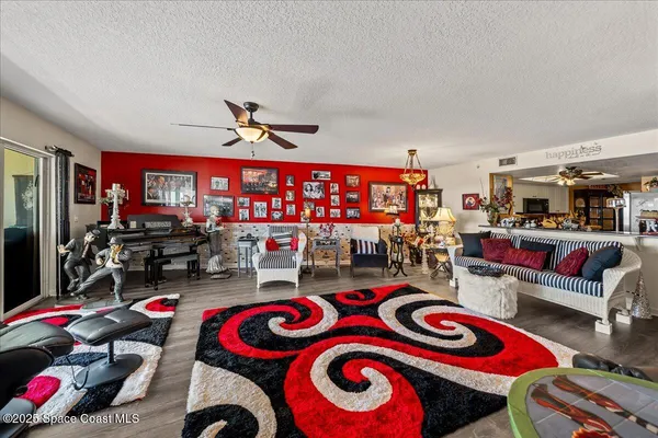 a living room with lots of furniture and a flat screen tv