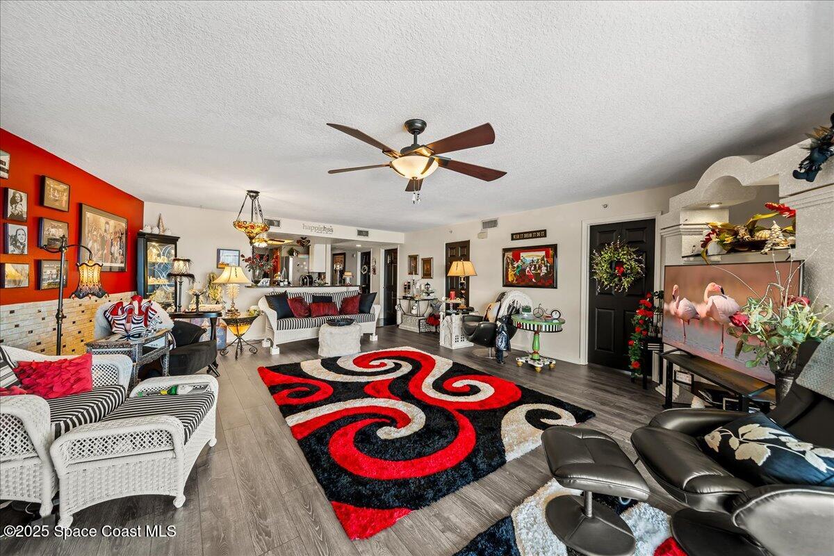104 Riverside Drive, Unit 203 Cocoa, FL 32922 - Photo 14 of 48 a living room with furniture and a flat screen tv