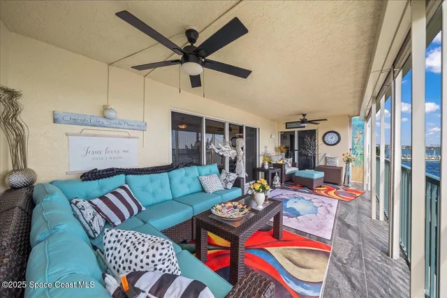 a bedroom with furniture and a flat screen tv