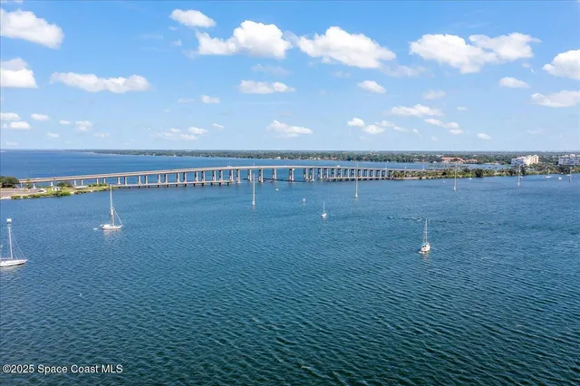 a view of a swimming pool and an outdoor seating