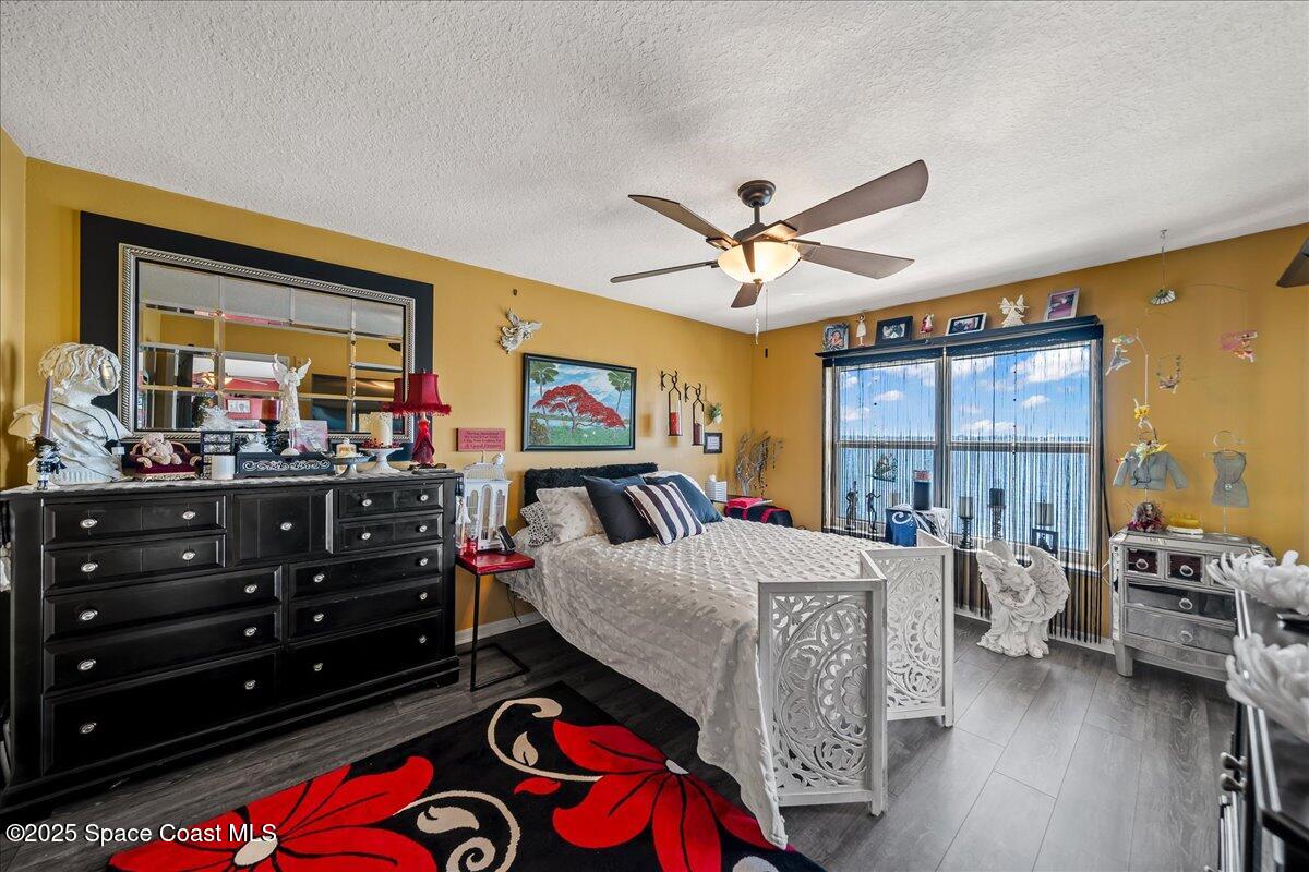 104 Riverside Drive, Unit 203 Cocoa, FL 32922 - Photo 22 of 48 a living room with furniture and a flat screen tv