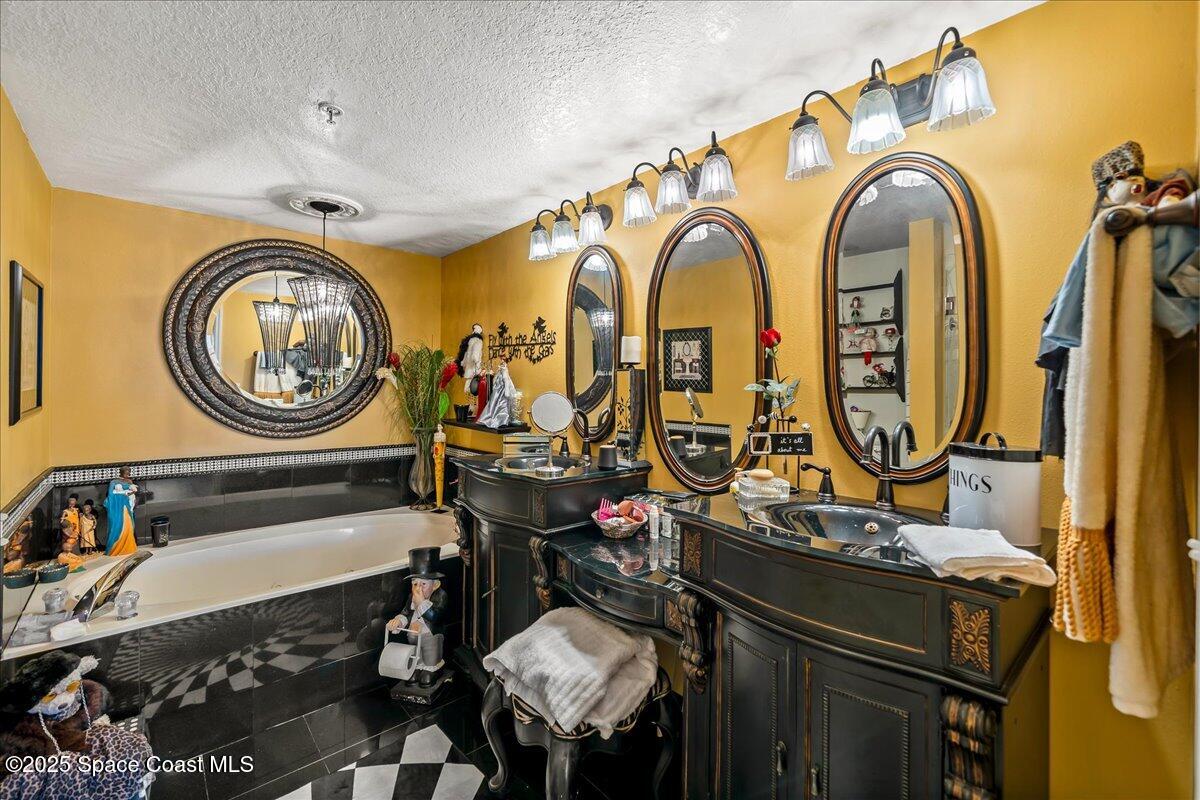 104 Riverside Drive, Unit 203 Cocoa, FL 32922 - Photo 24 of 48 a bathroom with a sink and a mirror