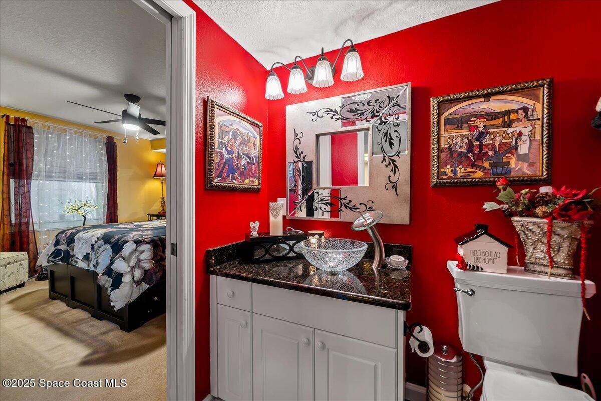 104 Riverside Drive, Unit 203 Cocoa, FL 32922 - Photo 30 of 48 a bedroom with bed and a mirror