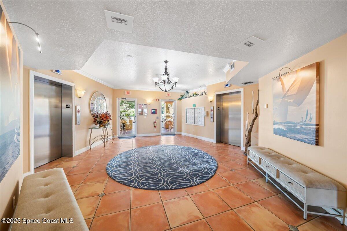 104 Riverside Drive, Unit 203 Cocoa, FL 32922 - Photo 35 of 48 a view of a living room and kitchen