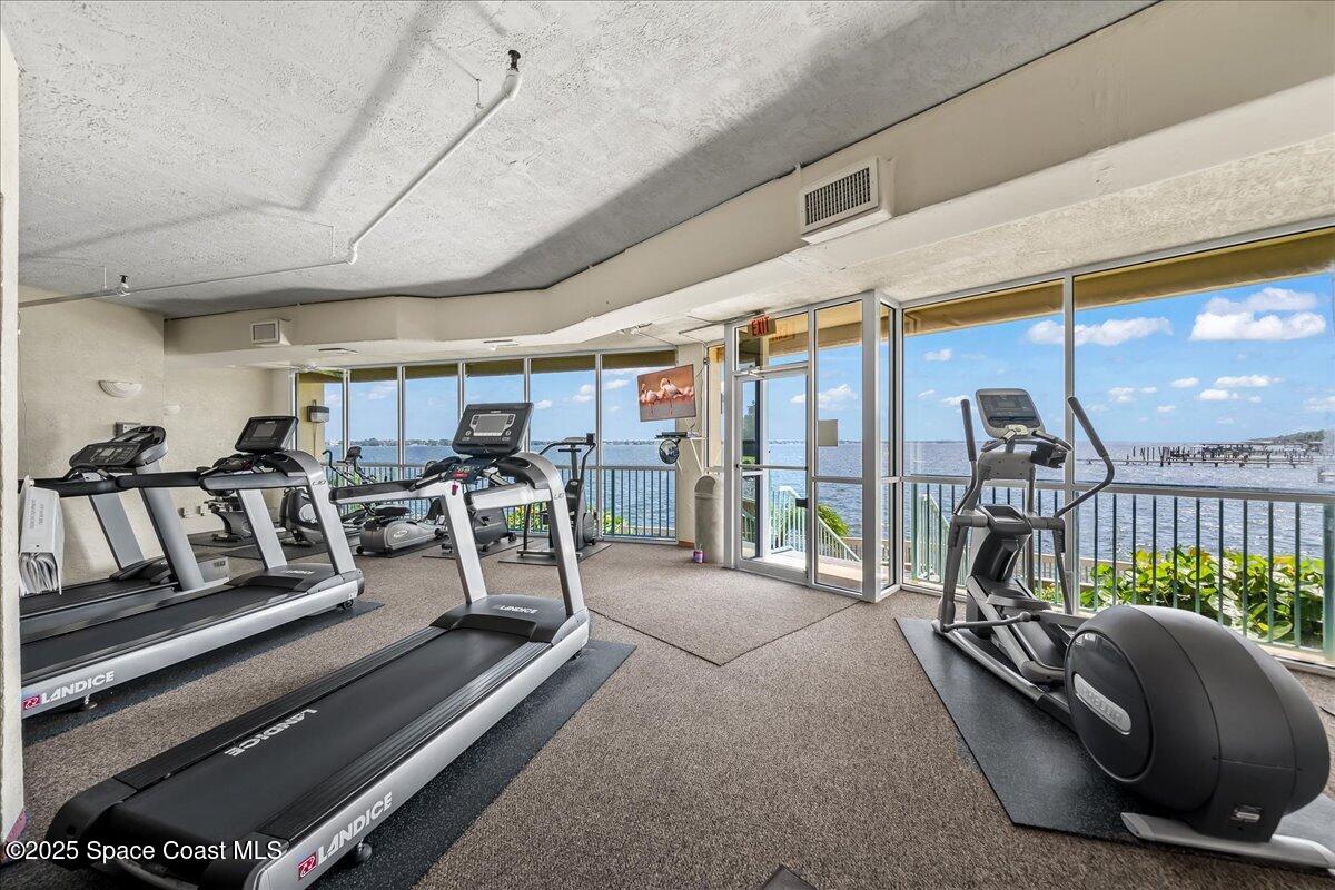 104 Riverside Drive, Unit 203 Cocoa, FL 32922 - Photo 36 of 48 a view of a room with gym equipment