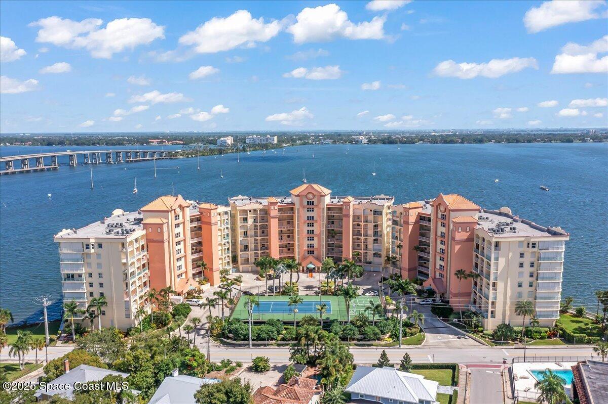 104 Riverside Drive, Unit 203 Cocoa, FL 32922 - Photo 43 of 48 a view of a city with tall buildings and lake view