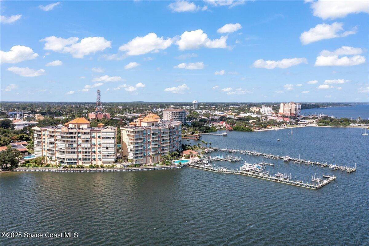 104 Riverside Drive, Unit 203 Cocoa, FL 32922 - Photo 46 of 48 an aerial view of ocean and residential houses with outdoor space