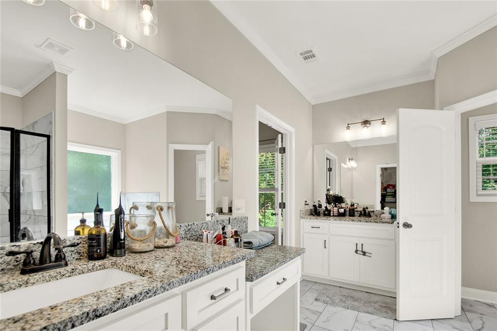 407 Corinth Church Road Winder, GA 30680 - Photo 44 of 66 a bathroom with sink and mirror