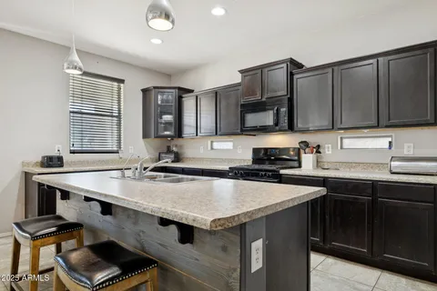 a kitchen with a stove and a sink