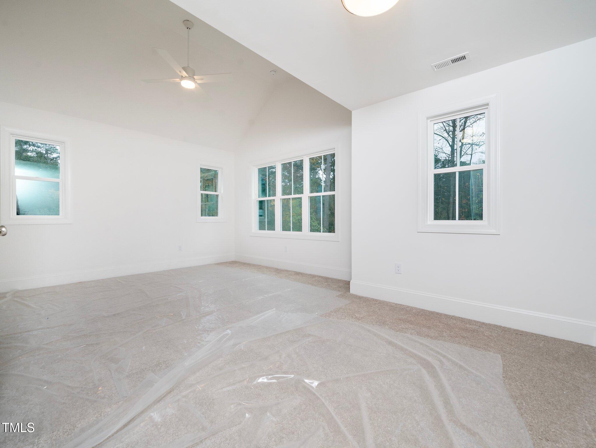 1223 Chaney Road Raleigh, NC 27606 - Photo 12 of 25 an empty room with windows