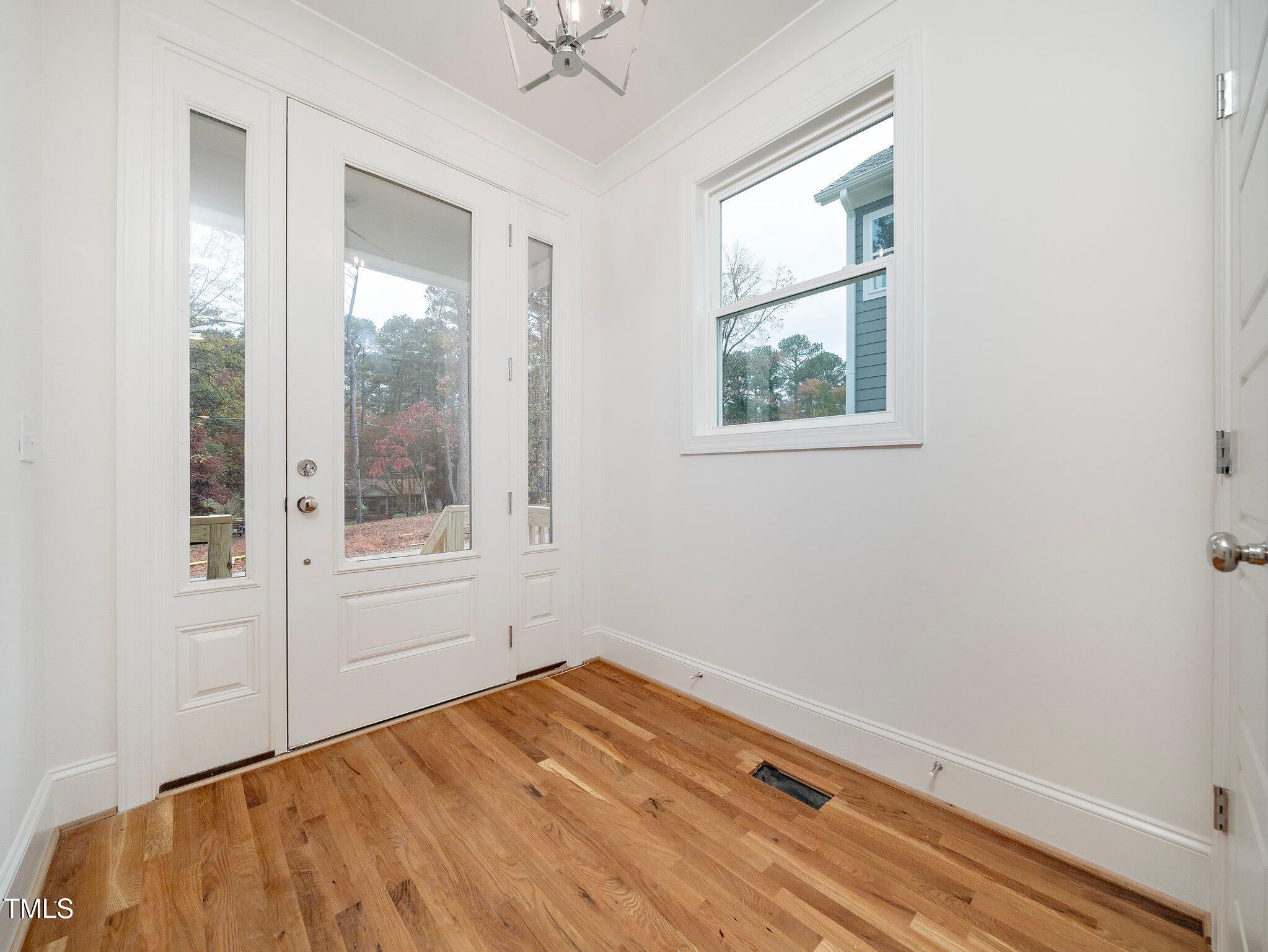 1223 Chaney Road Raleigh, NC 27606 - Photo 2 of 25 an empty room with a window