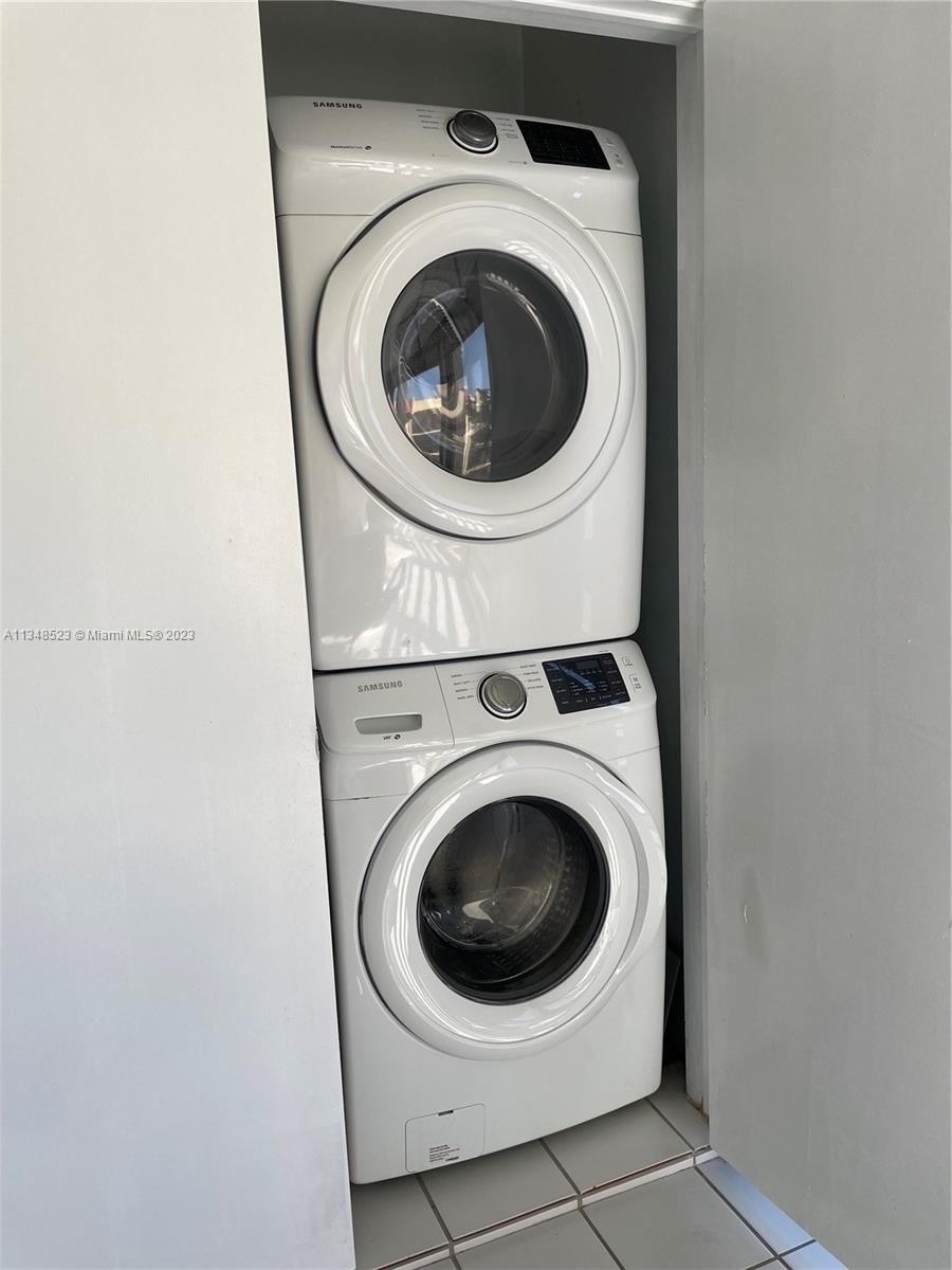 23370 Carolwood Lane, Unit 2202 Boca Raton, FL 33428 - Photo 18 of 31 a utility room with dryer and washer