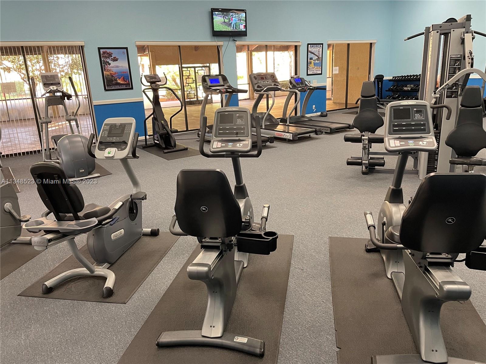 23370 Carolwood Lane, Unit 2202 Boca Raton, FL 33428 - Photo 24 of 31 a view of a room with gym equipment