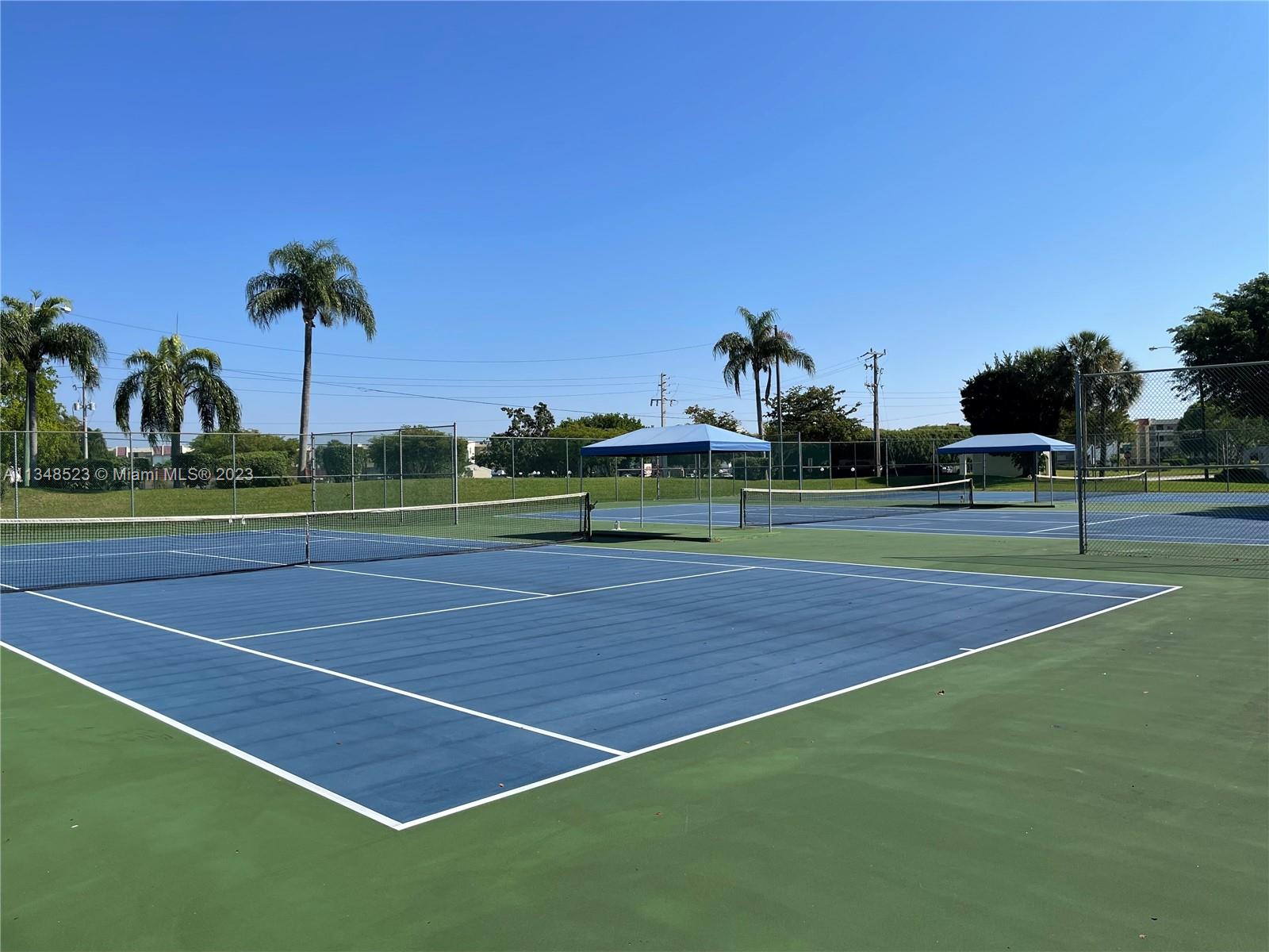 23370 Carolwood Lane, Unit 2202 Boca Raton, FL 33428 - Photo 31 of 31 a view of a tennis court