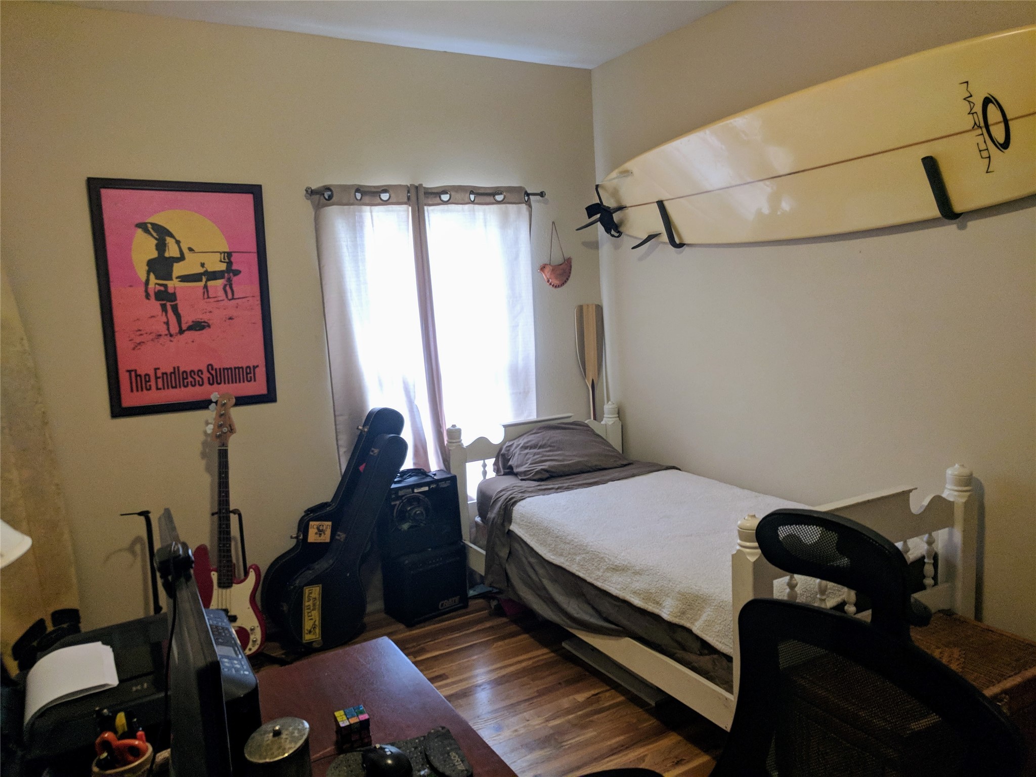 4615 Woodside Street Houston, TX 77023 - Photo 15 of 25 a bed room with a bed and a couch