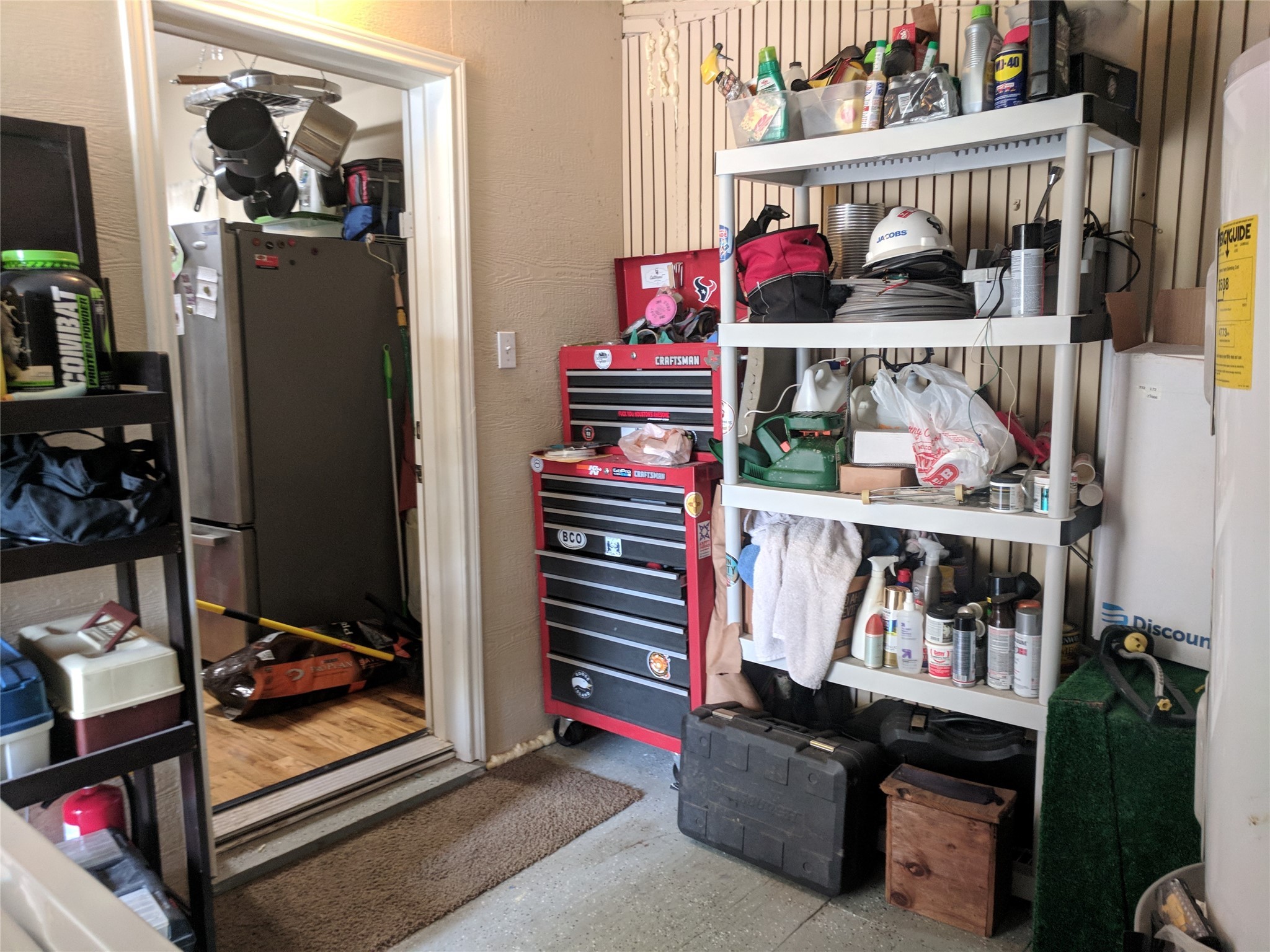 4615 Woodside Street Houston, TX 77023 - Photo 17 of 25 a room with lots of different colored cloths