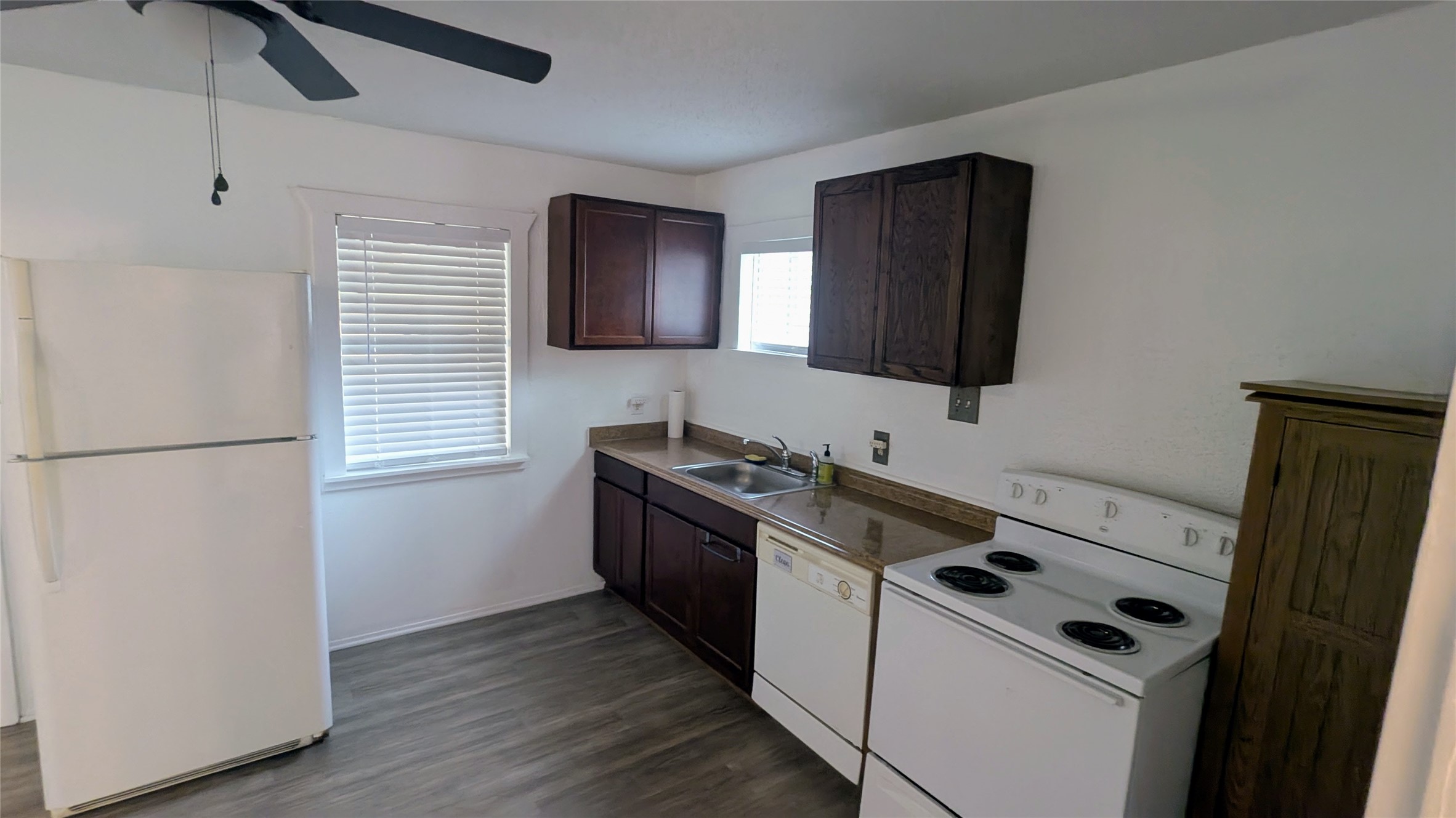 4615 Woodside Street Houston, TX 77023 - Photo 20 of 25 a kitchen with a stove and a microwave