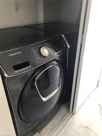 a utility room with washing machine