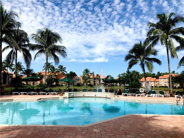 a view of swimming pool with outdoor seating