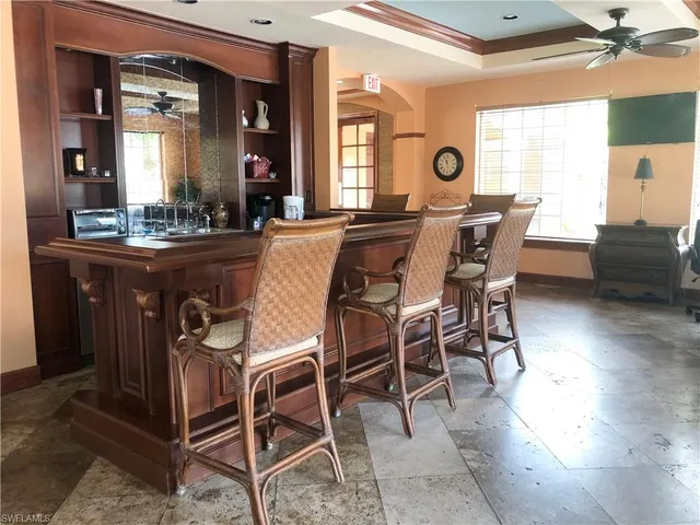 a view of a dining room with furniture and window