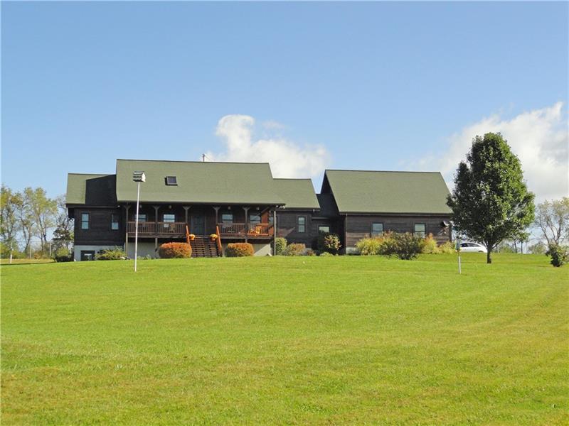 13 year young custom built log home on 3 acres, thoughtfully designed for use & energy