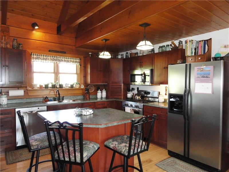 528 Dick Station Road Irwin, PA 15642 - Photo 6 of 25 Cherry kitchen cabinets, island and stainless steel appliances. Propane gas range!