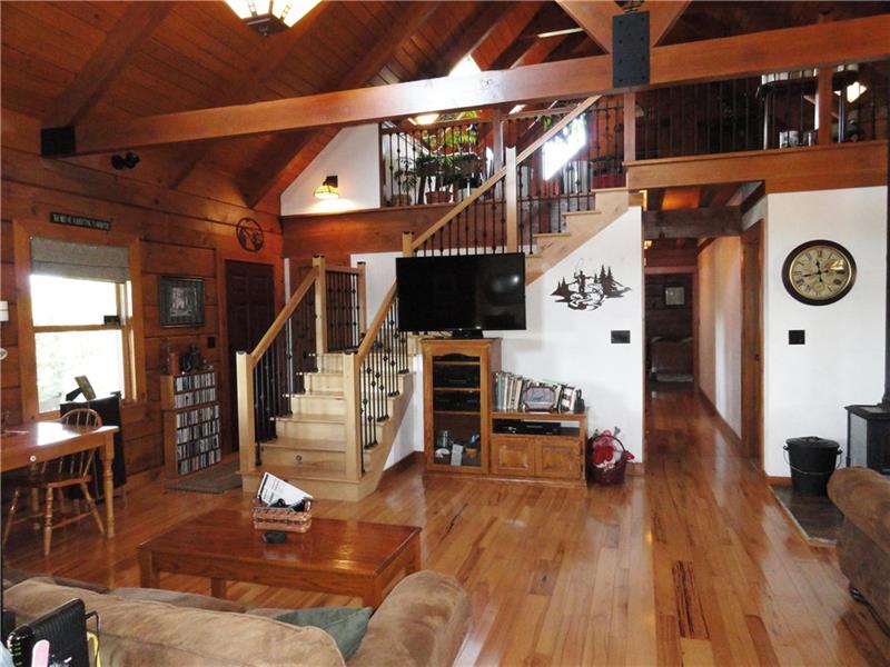 528 Dick Station Road Irwin, PA 15642 - Photo 8 of 25 Hickory floors, staircase. 36 solid 6 panel doors and wood trim throughout. Open floor plan!