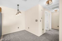 7701 West Robindale Road, Unit 277 Las Vegas, NV 89113 - Photo 12 of 33 A quiet room awaits, ideal for a study or a cozy reading nook.