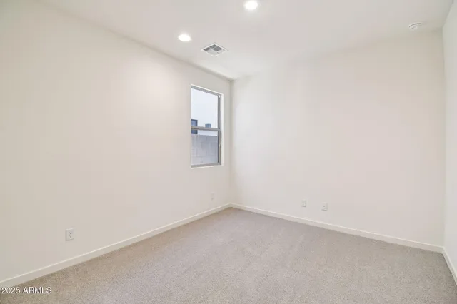 an empty room with a empty space and window