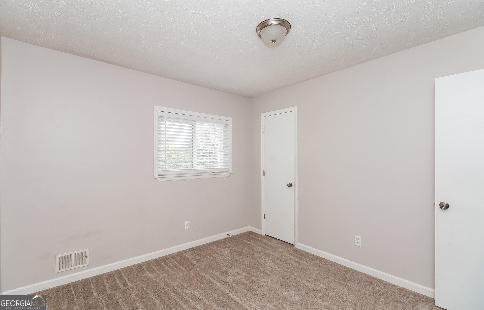 3020 Creel Road South Fulton, GA 30349 - Photo 11 of 18 an empty room with a window
