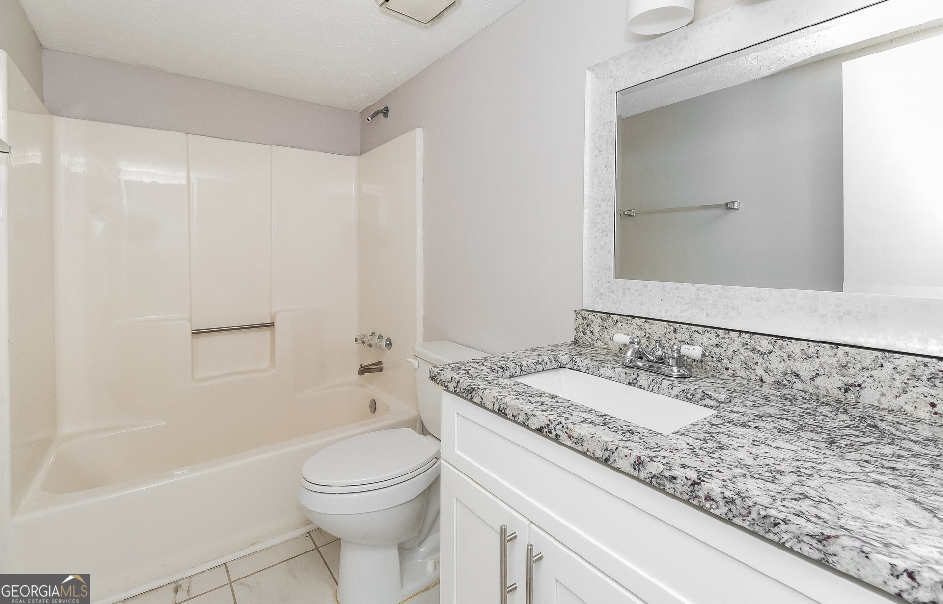 3020 Creel Road South Fulton, GA 30349 - Photo 13 of 18 a bathroom with a granite countertop sink a toilet and shower