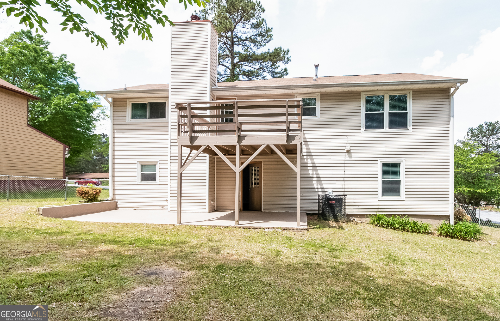 3020 Creel Road South Fulton, GA 30349 - Photo 15 of 18 a view of a house with backyard and a tree