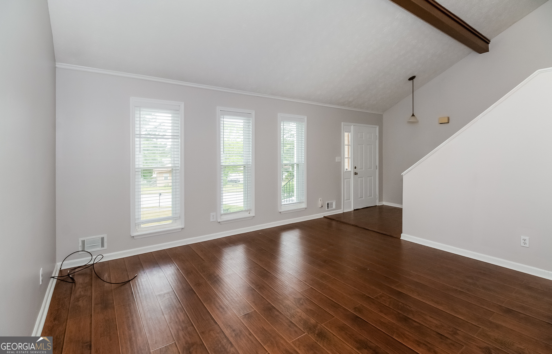 3020 Creel Road South Fulton, GA 30349 - Photo 2 of 18 a view of an empty room with wooden floor and a window