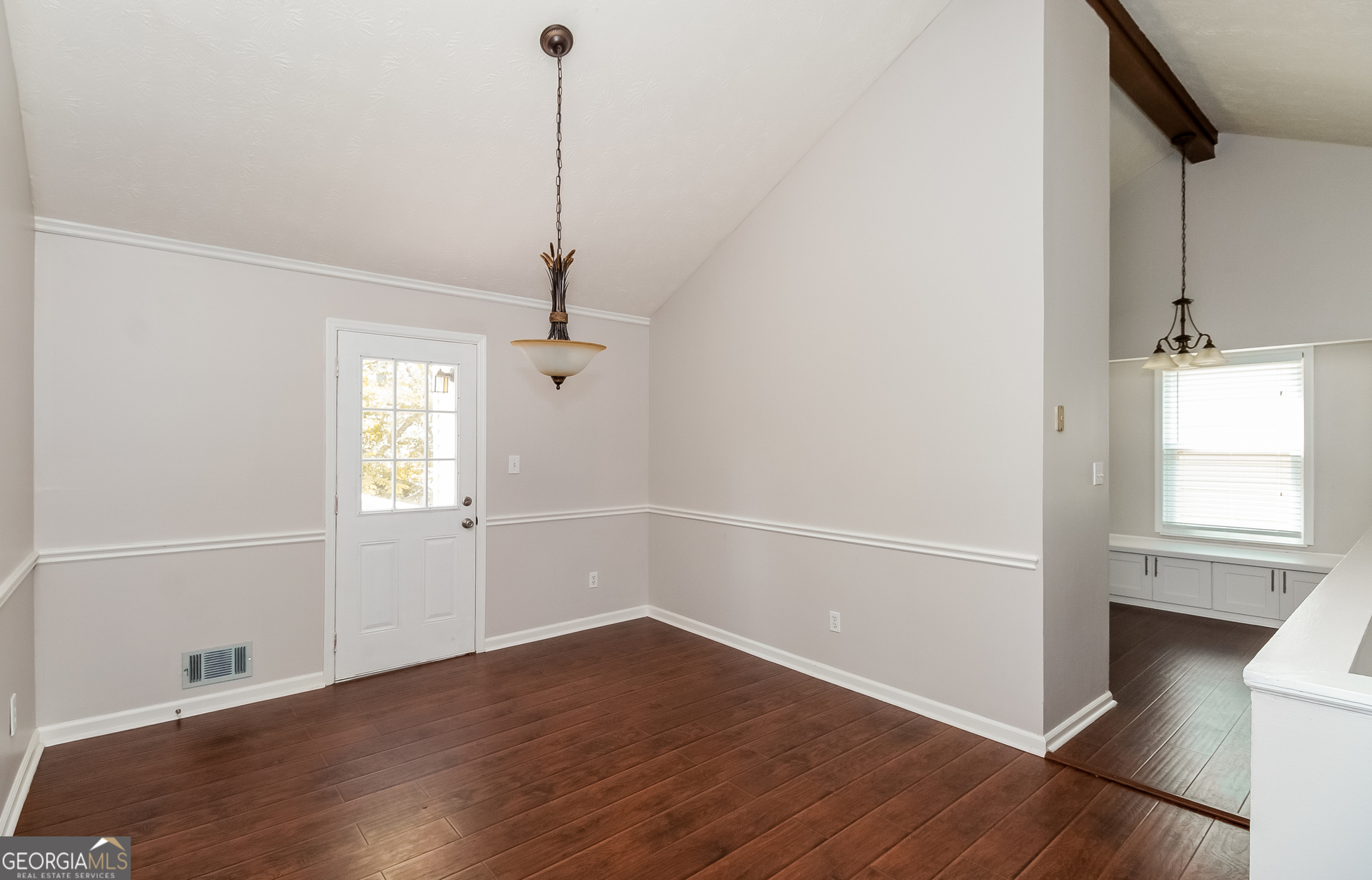 3020 Creel Road South Fulton, GA 30349 - Photo 4 of 18 an empty room with wooden floor and windows