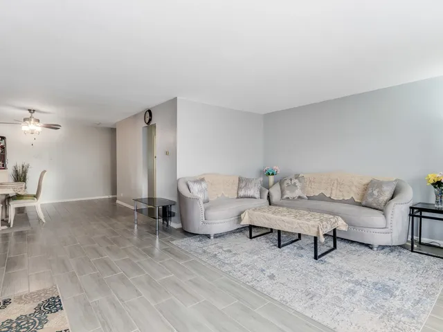 a living room with furniture and a table
