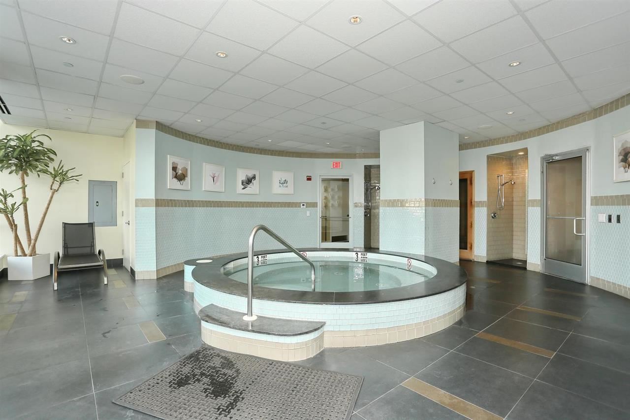 2 2nd Street, Unit 3304 Jersey City, NJ 07302 - Photo 18 of 25 a kitchen with a table and chairs