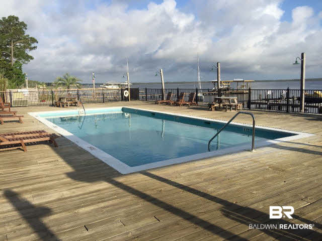 25773 Canal Road, Unit 26 Orange Beach, AL 36561 - Photo 27 of 42 Pool overlooking the marina and bay
