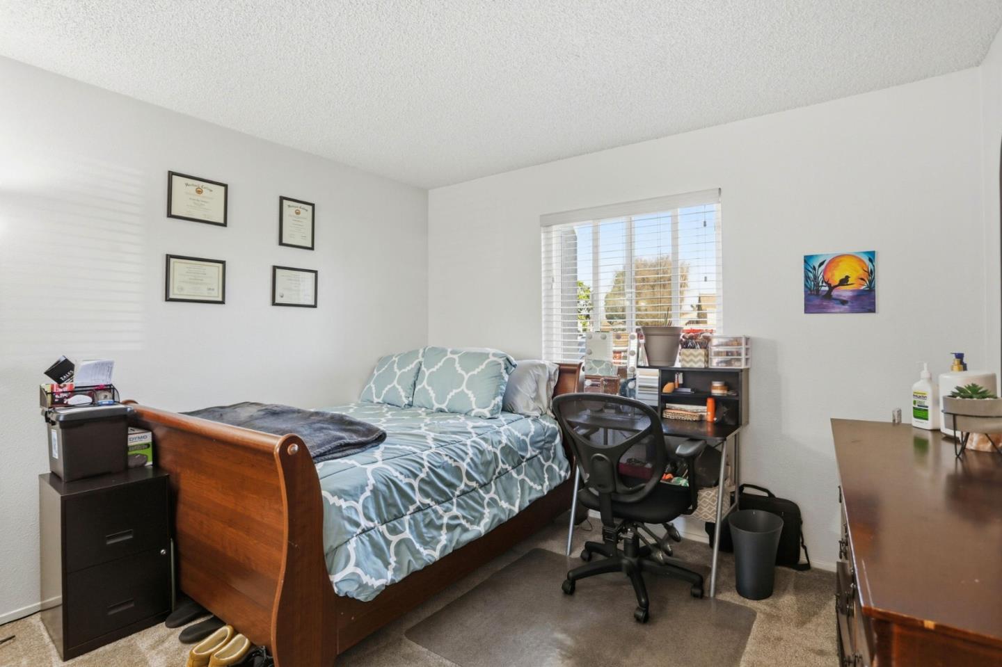 1075 Sherman Drive Salinas, CA 93907 - Photo 12 of 24 a bedroom with a bed and a table chair