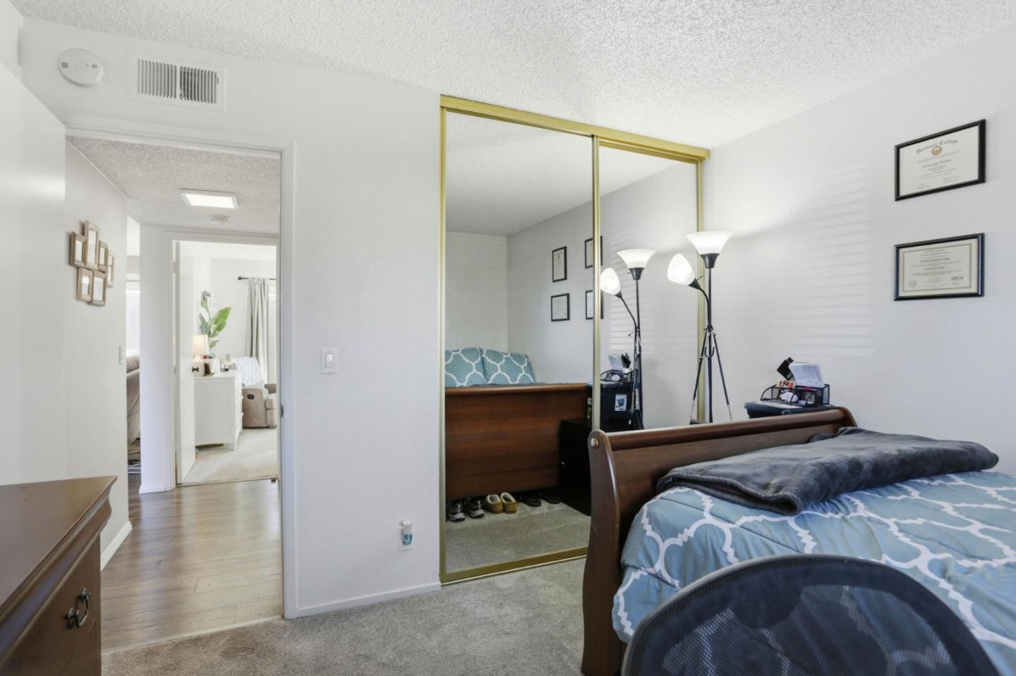 1075 Sherman Drive Salinas, CA 93907 - Photo 13 of 24 a bedroom with a bed and a mirror