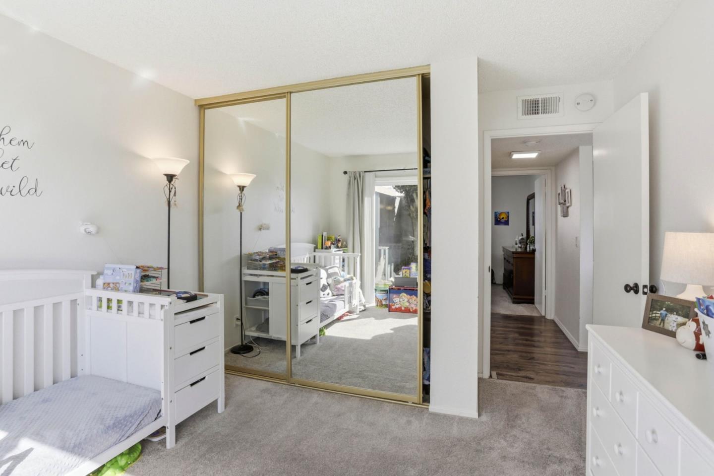 1075 Sherman Drive Salinas, CA 93907 - Photo 15 of 24 a large white room with mirror and furniture