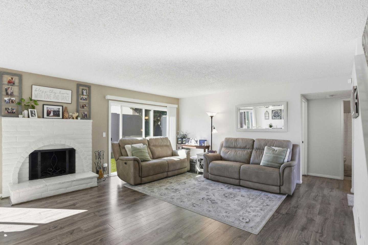 1075 Sherman Drive Salinas, CA 93907 - Photo 5 of 24 a living room with furniture and a fireplace