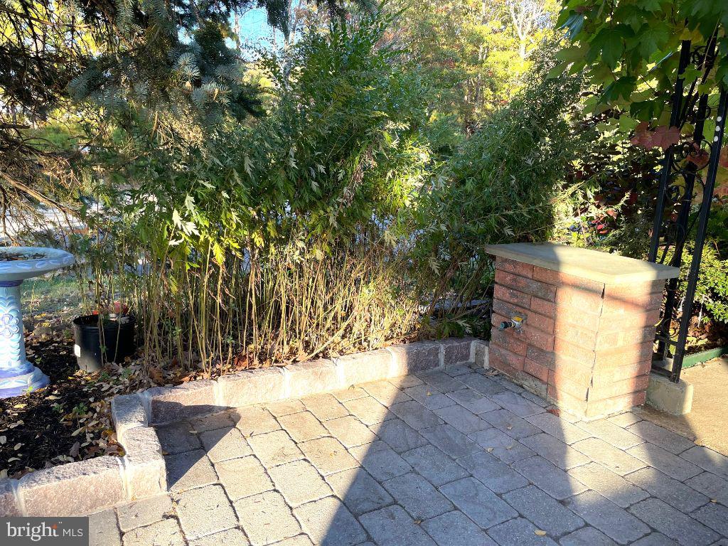 44B Stage Road Manahawkin, NJ 08050 - Photo 17 of 21 a view of a pathway with a bench in front of house