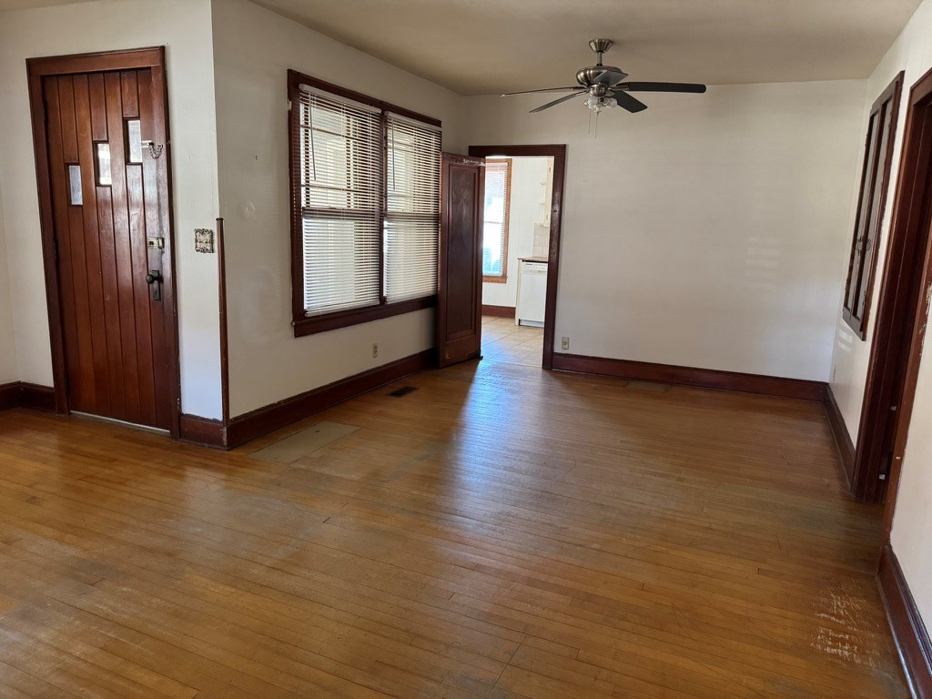 245 Blue Ridge Drive McCaysville, GA 30555 - Photo 5 of 20 an empty room with wooden floor and windows