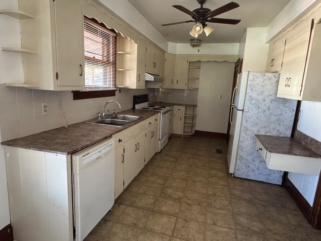 245 Blue Ridge Drive McCaysville, GA 30555 - Photo 7 of 20 a kitchen with a sink stove and cabinets