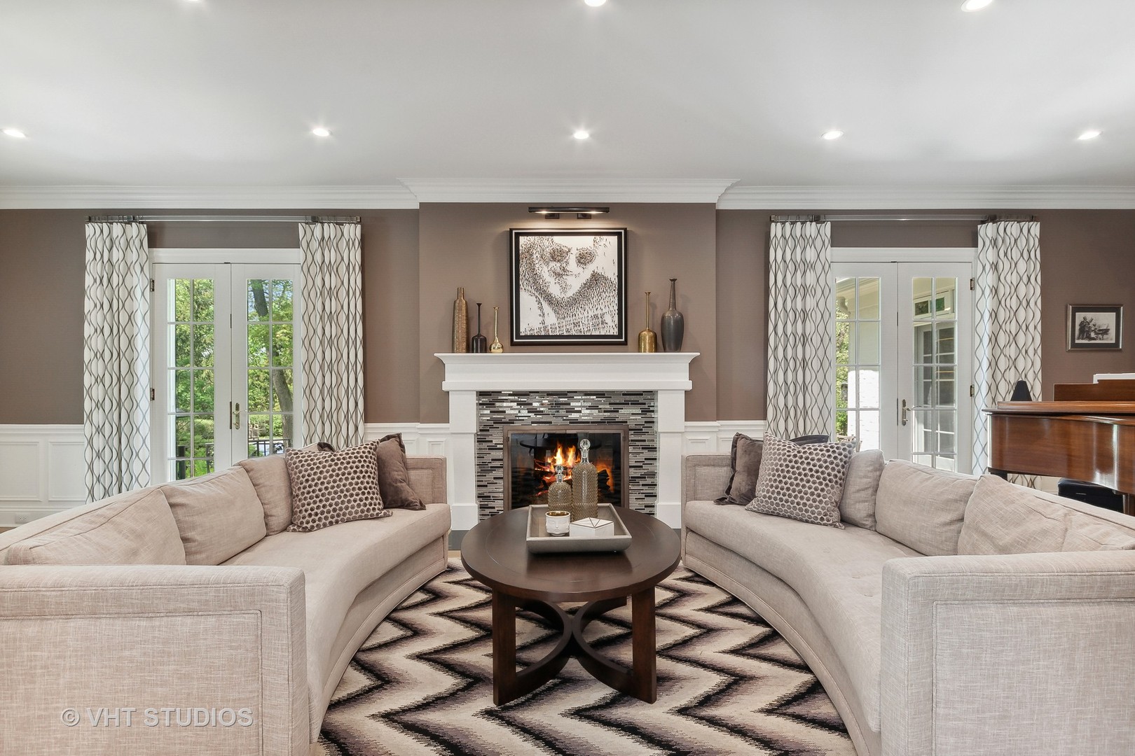 34 Oak Knoll Road Barrington Hills, IL 60010 - Photo 24 of 82 a living room with furniture a large window and a fireplace